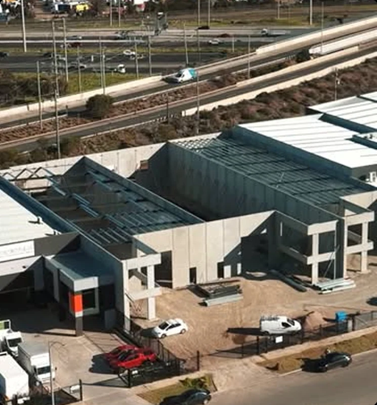 Industrial construction site with precast wall installation